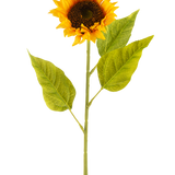 De Kunstbloem Zonnebloem 71 cm geel is een kunstzonnebloem met heldergele bloemblaadjes, een donkerbruin hart en drie grote groene bladeren op een lange groene steel, tegen een effen witte achtergrond.