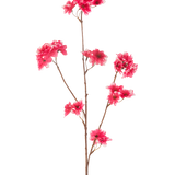 De Kunstbloem Kersenbloesem 85 cm fuchsia heeft een enkele bruine steel met meerdere takken, elk versierd met clusters van levendige fuchsia kunstkersenbloesems, tegen een effen witte achtergrond.