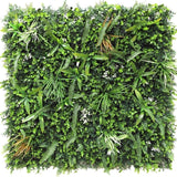 De Kunsthaag Savanne brandvertragend 100x100 cm is een vierkant paneel met dicht, brandvertragend kunstgroen gebladerte met gemengde plantenbladeren zoals varens en grassen voor een weelderig verticaal tuineffect.