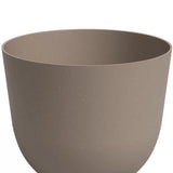 De Plantenbak Havanna Ø20cm x H17cm is een effen, ronde, lichtbruine bloempot met een gladde matte afwerking en zonder zichtbare decoraties, afgebeeld tegen een witte achtergrond.